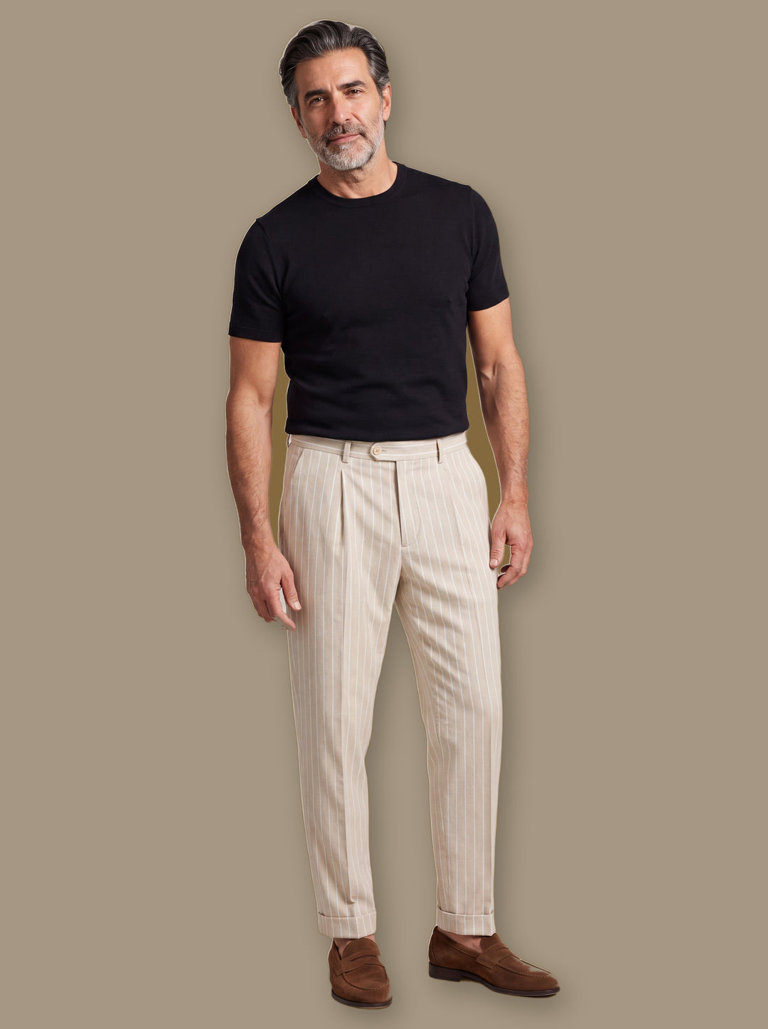 Randolph trousers in Cream, worn by a model on a warm taupe studio background - Gentlemens Manor