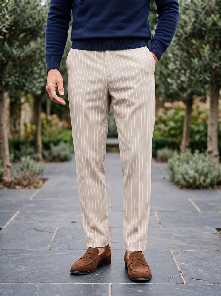 Randolph trousers in Cream, worn by a model in a Mediterranean setting - Gentlemens Manor lifestyle