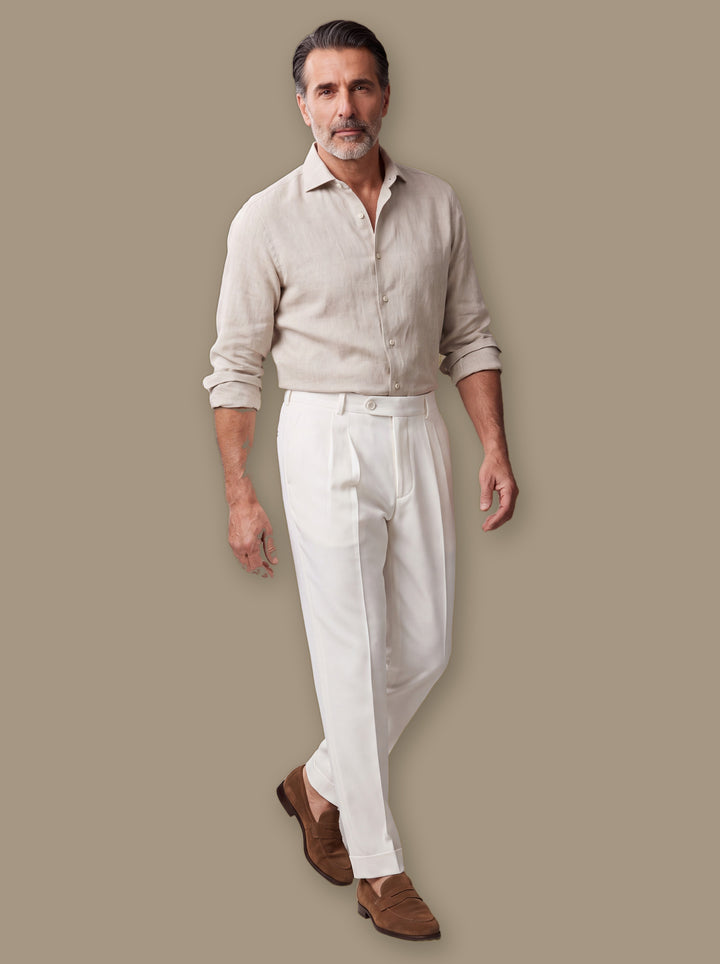 Ransom trousers in White, worn by a model on a warm taupe studio background - Gentlemens Manor