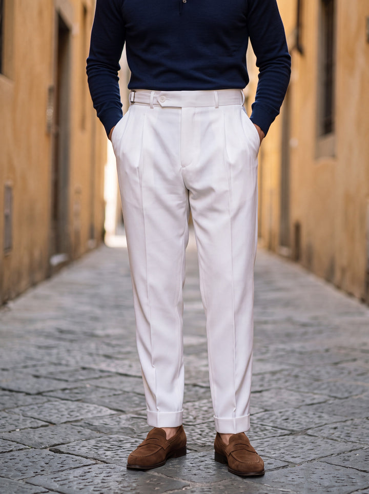 Ransom trousers in White, worn by a model in a Mediterranean setting - Gentlemens Manor lifestyle