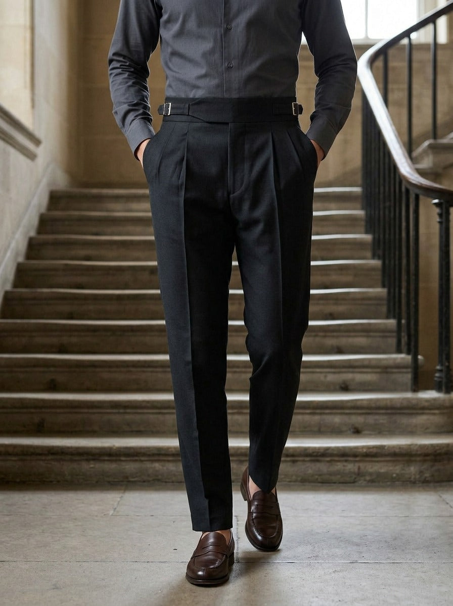 Ravenel gurkha trousers in Black, lifestyle on a civic stone staircase, Gentlemens Manor