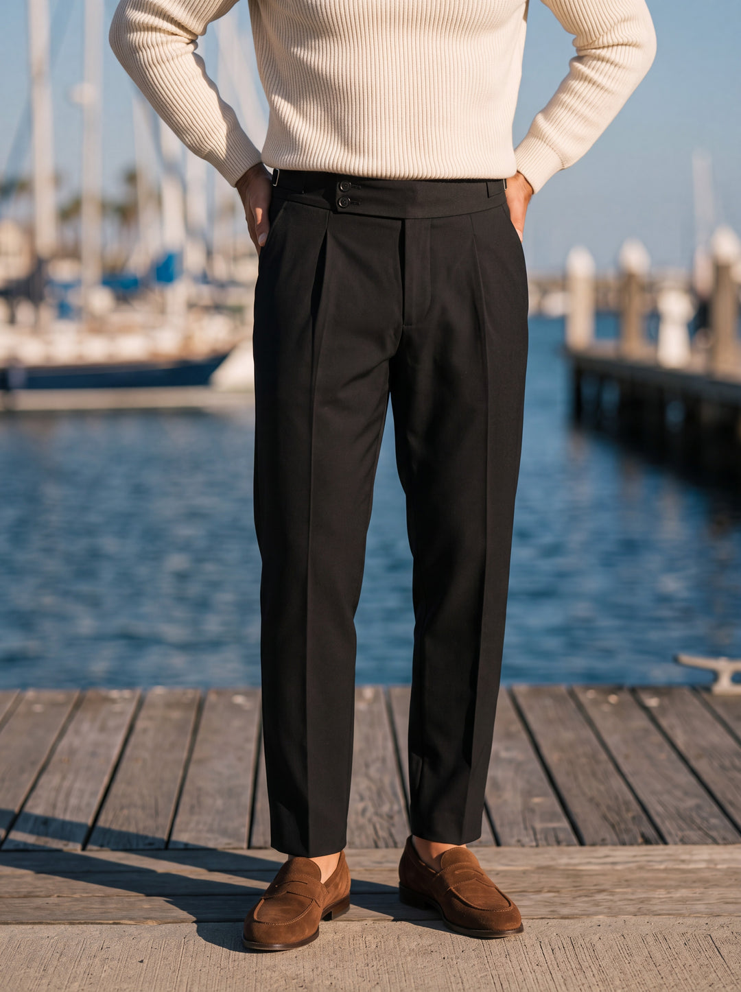 Raymond trousers in Black, worn by a model in a Mediterranean setting - Gentlemens Manor lifestyle