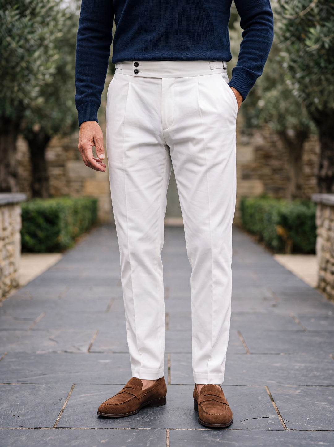 Raymond trousers in White, worn by a model in a Mediterranean setting - Gentlemens Manor lifestyle