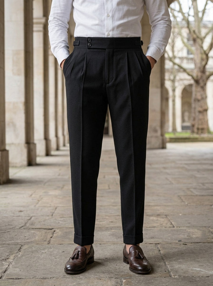 Redfield dress pants in Black, lifestyle in a stone colonnade, Gentlemens Manor