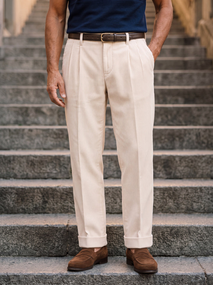 Reginald trousers in Beige, worn by a model in a Mediterranean setting - Gentlemens Manor lifestyle