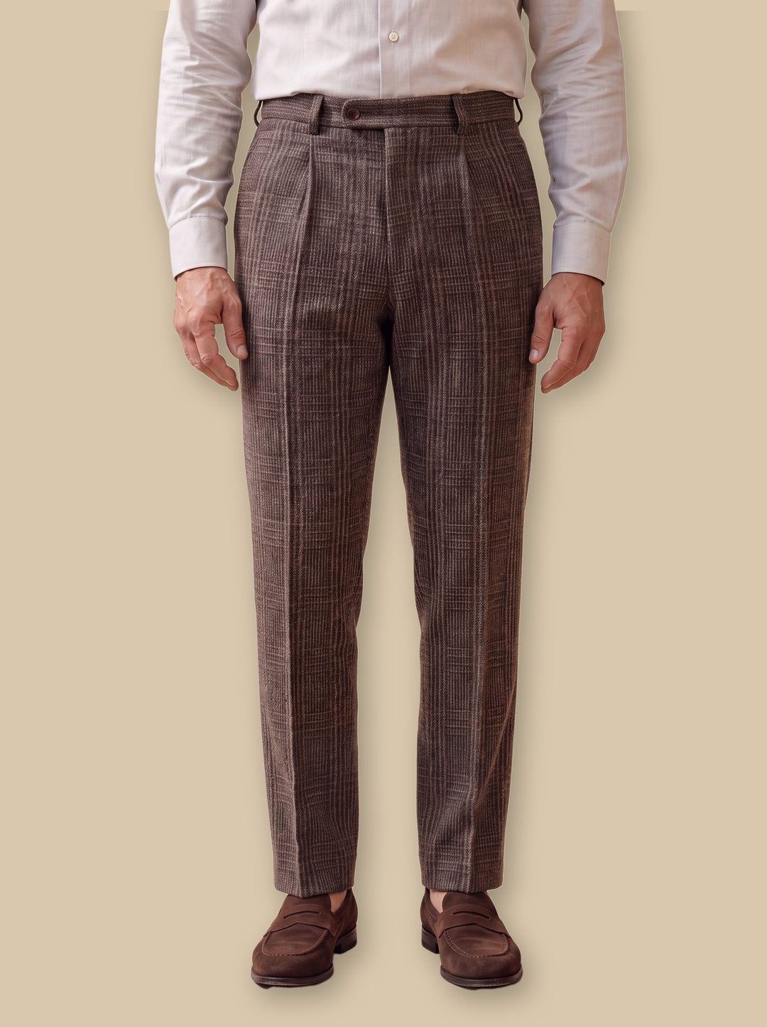 Reid trousers in Brown, worn by a model on a warm sand studio background - Gentlemens Manor