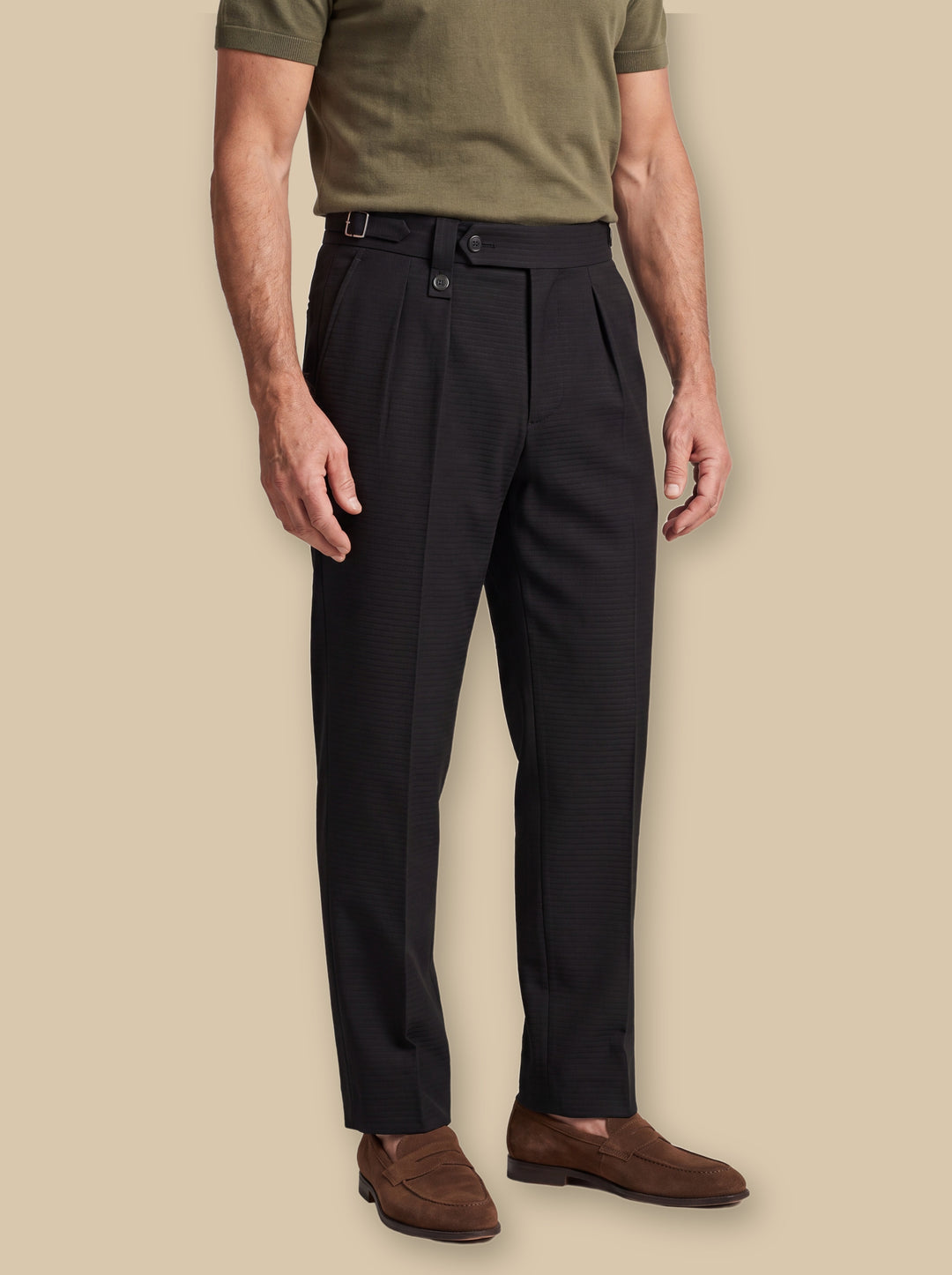 Rhett trousers in Black, worn by a model on a warm sand studio background - Gentlemens Manor