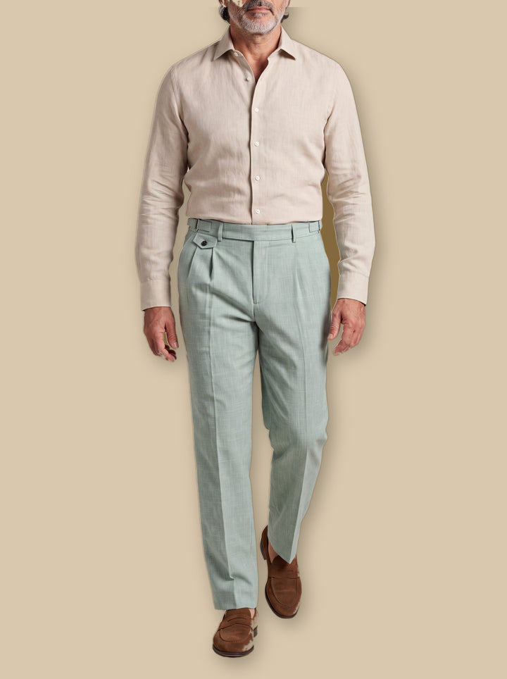 Richmond trousers in Green, worn by a model on a warm sand studio background - Gentlemens Manor