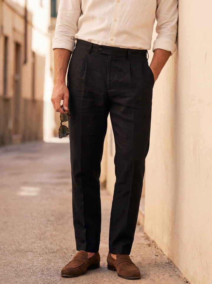 Robert Men trousers in black, worn by a model on a Mediterranean terrace - Gentlemens Manor lifestyle