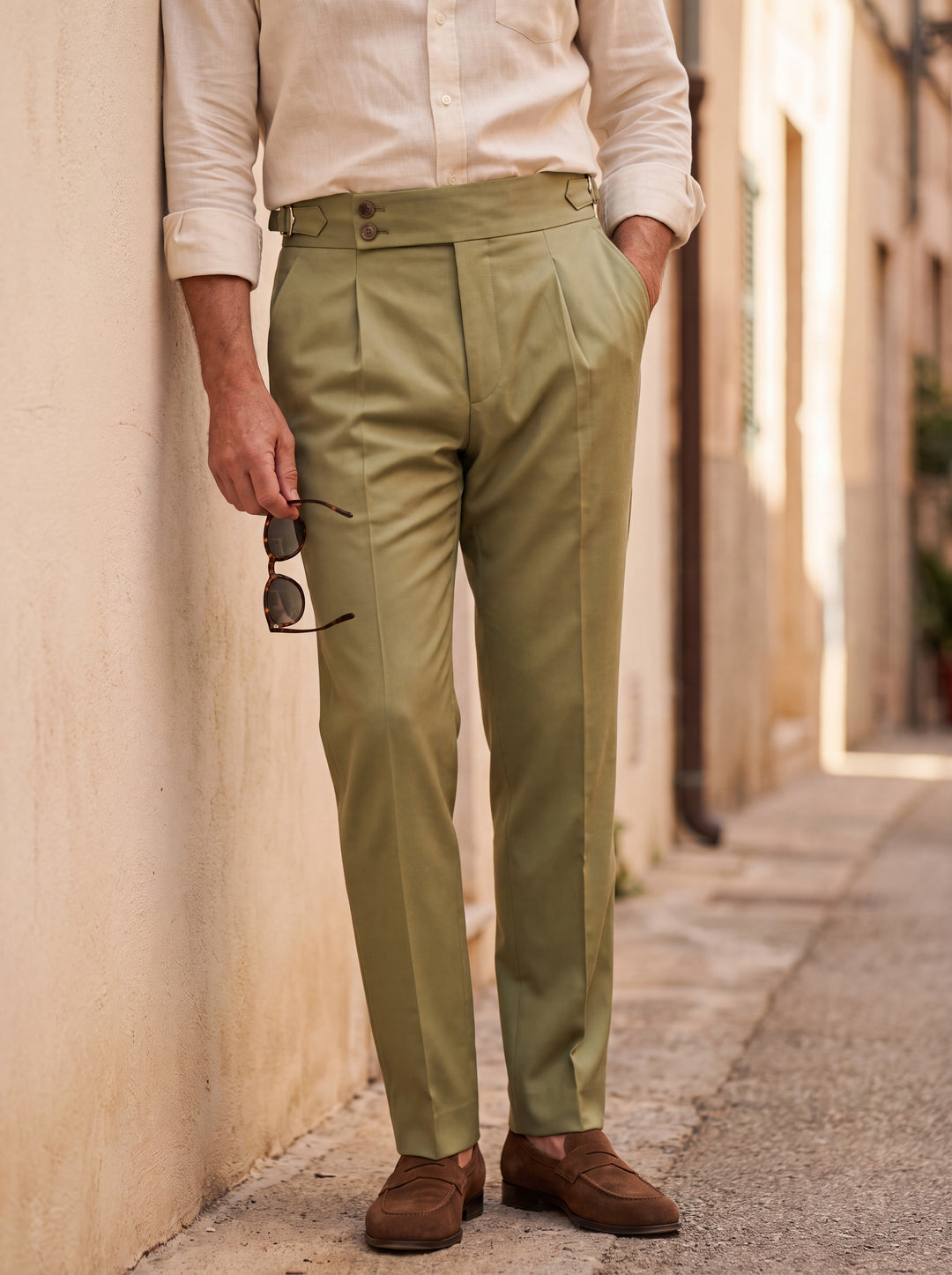 Rodney Men trousers in Olive, worn by a model on a Mediterranean terrace - Gentlemens Manor lifestyle