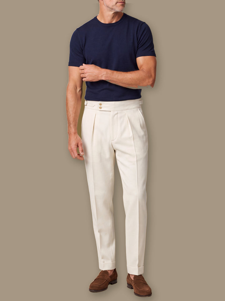 Rodney trousers in White, worn by a model on a warm taupe studio background - Gentlemens Manor