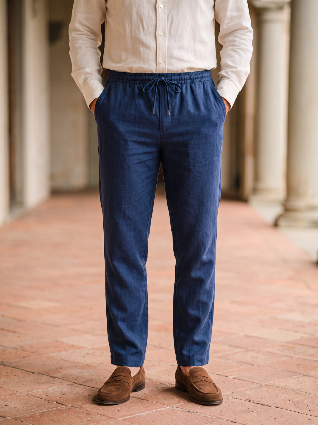 Roger trousers in Navy, worn by a model in a Mediterranean setting - Gentlemens Manor lifestyle