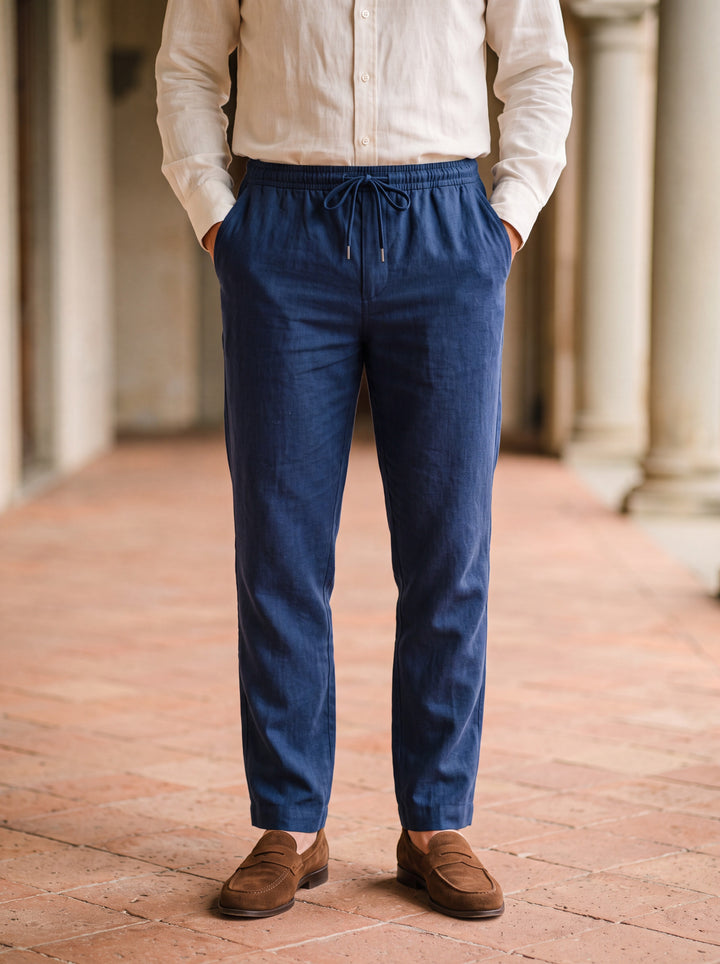 Roger trousers in Navy, worn by a model in a Mediterranean setting - Gentlemens Manor lifestyle