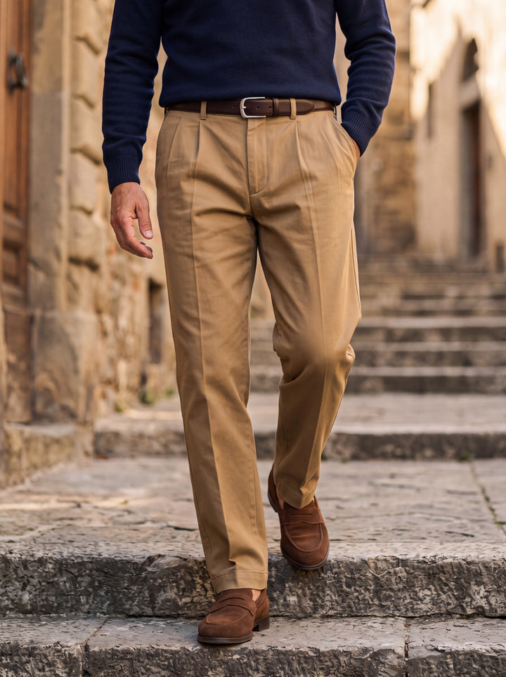 Roland trousers in Sand, worn by a model in a Mediterranean setting - Gentlemens Manor lifestyle