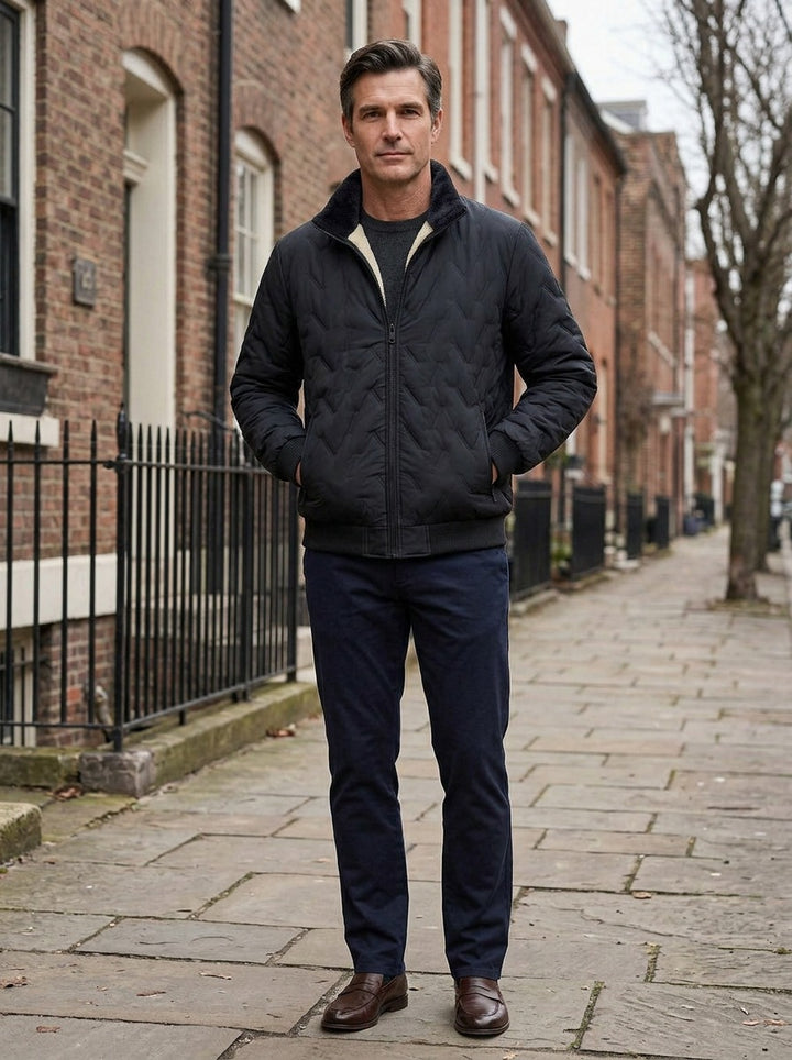 Roscoe quilted plush lined jacket in Black, lifestyle on a street of brick row houses, Gentlemens Manor