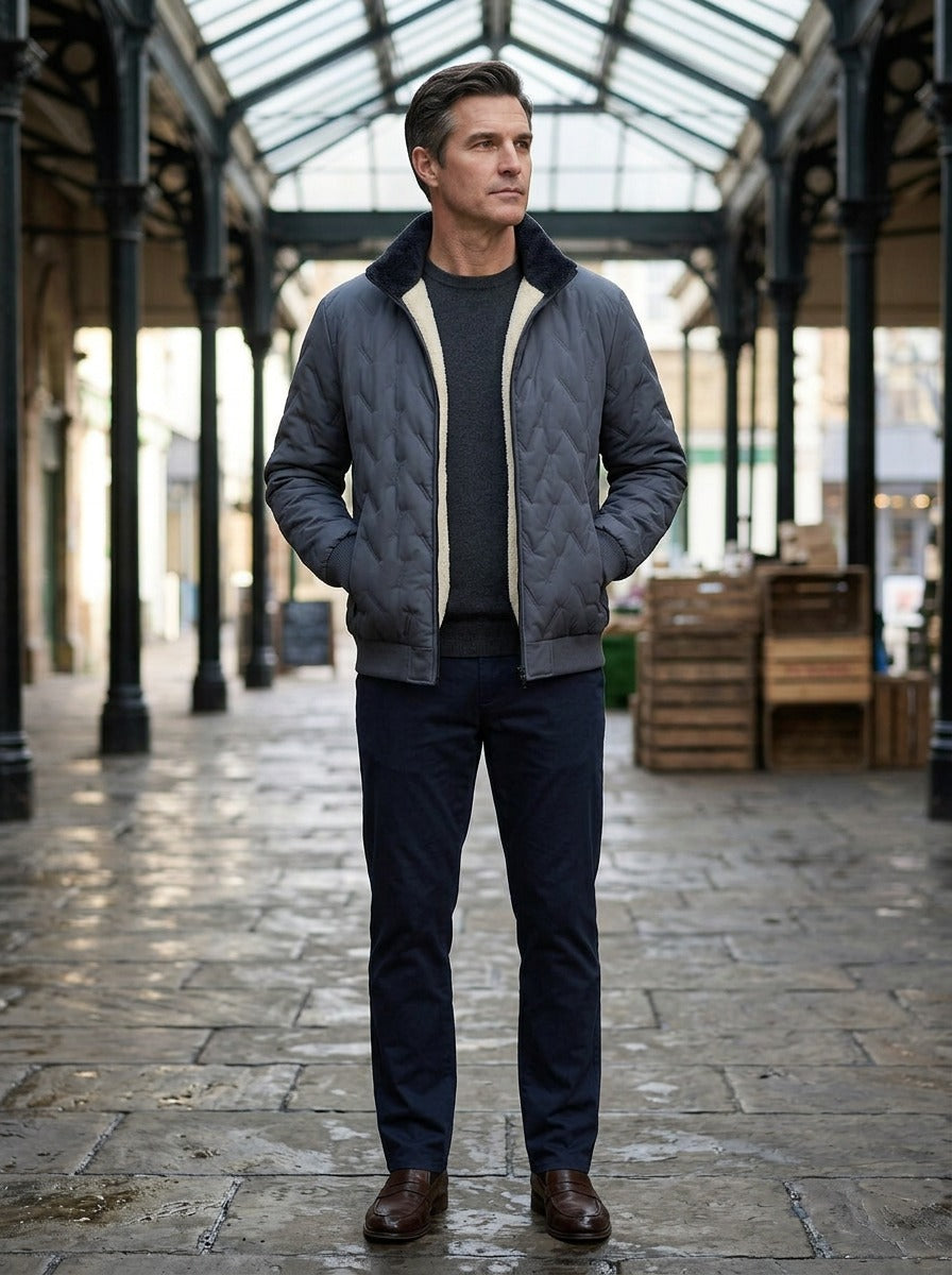 Roscoe quilted plush lined jacket in Grey, lifestyle in a covered market hall, Gentlemens Manor