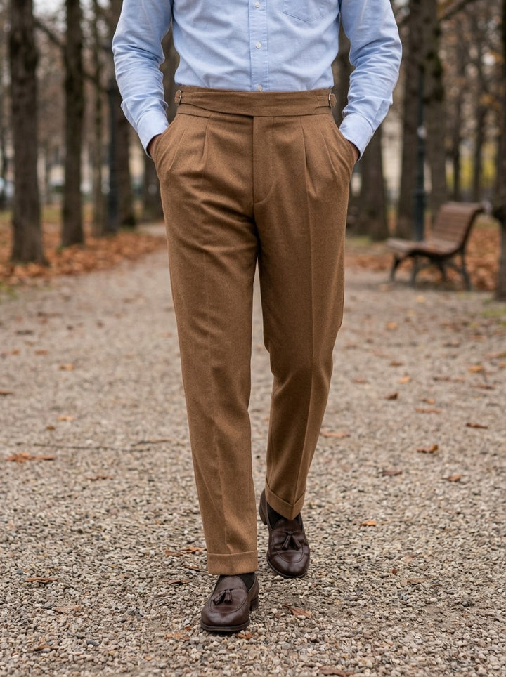 Rupert turn up cuff pleated trousers in Camel, lifestyle on a park path, Gentlemens Manor