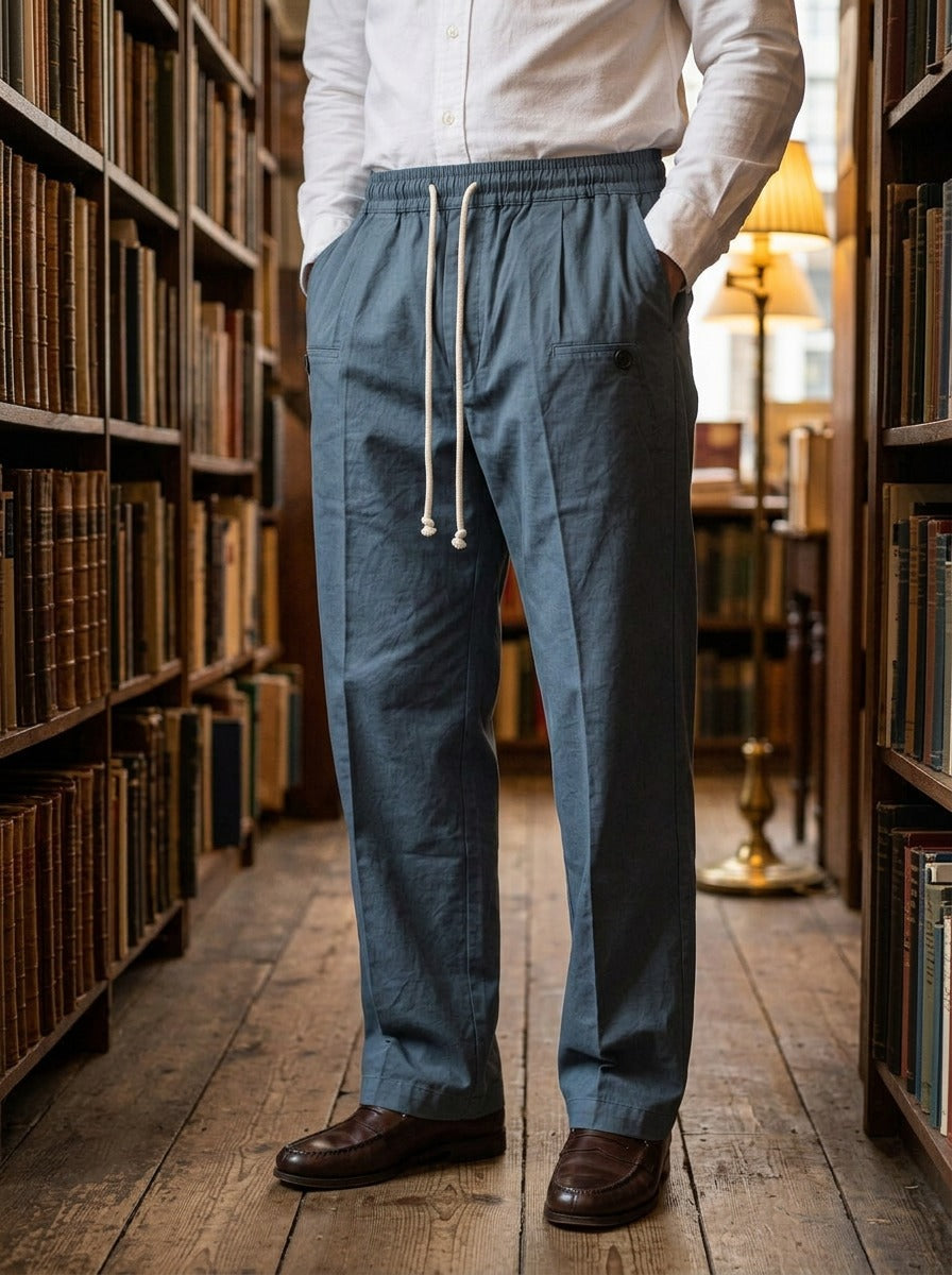 Sedley pleated drawstring crease trousers in Blue, lifestyle in a secondhand bookshop, Gentlemens Manor