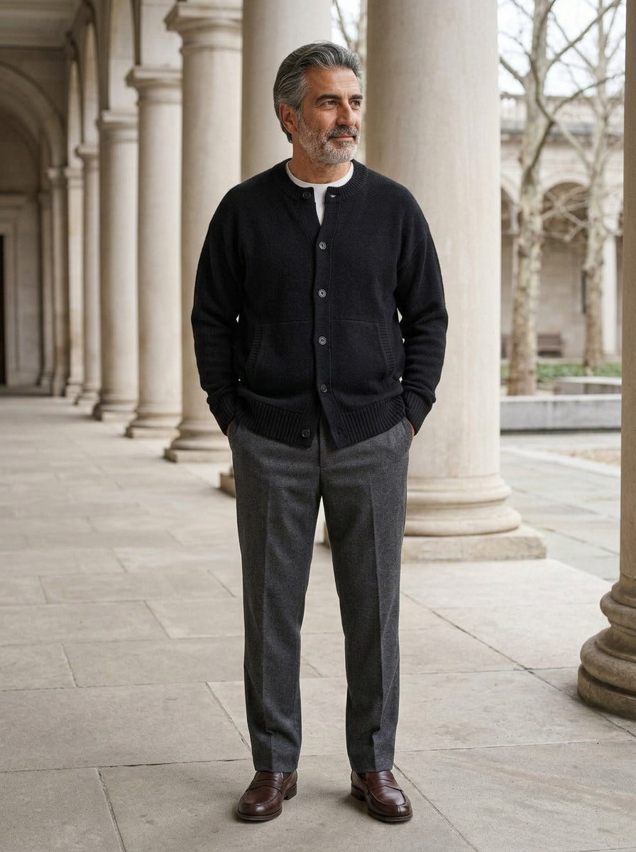 Selby round neck cardigan in Black, lifestyle in a stone colonnade, Gentlemens Manor