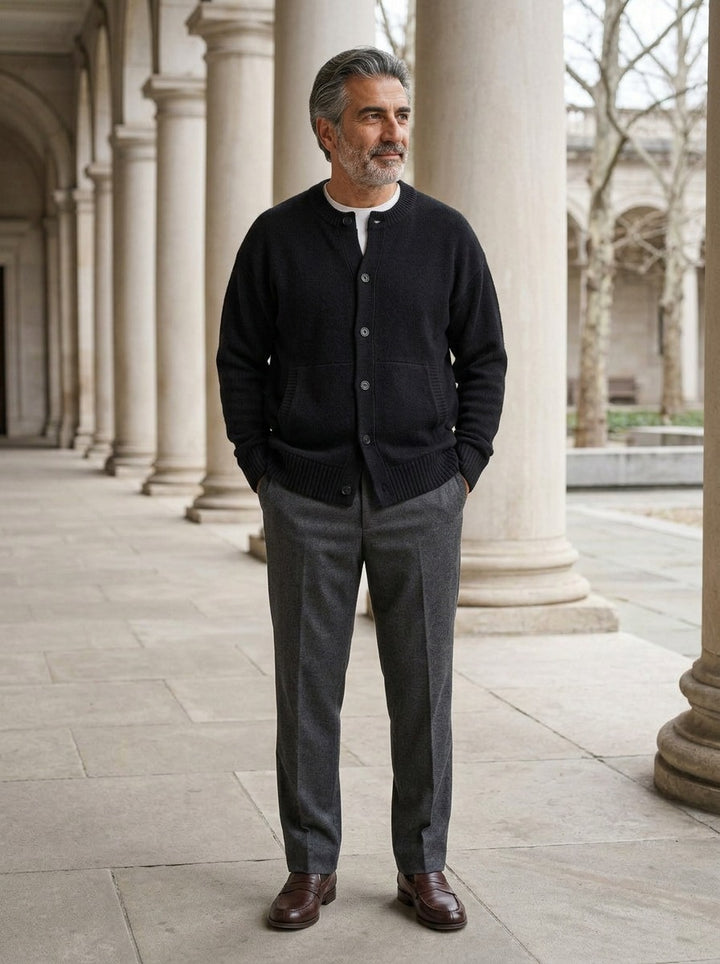 Selby round neck cardigan in Black, lifestyle in a stone colonnade, Gentlemens Manor