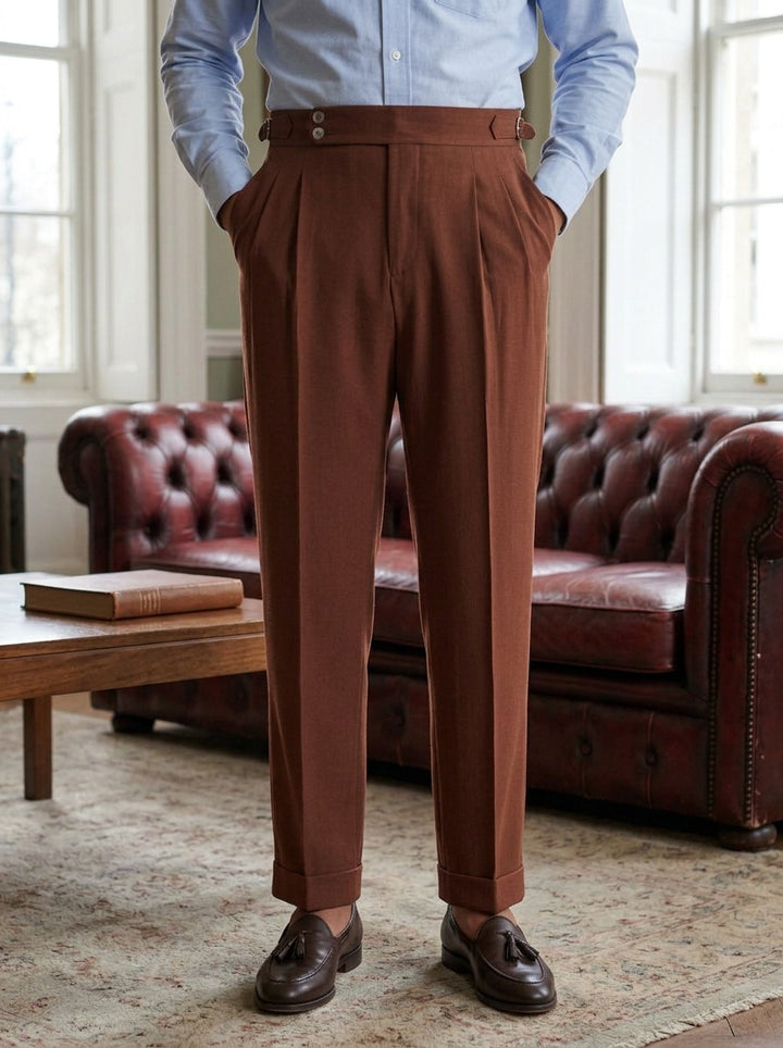 Somerset side buckle pleated trousers in Brown, lifestyle in a club reading room, Gentlemens Manor