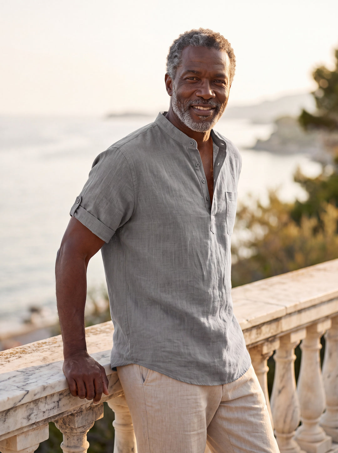 Sterling Men linen shirt in Grey, worn by a model on a Mediterranean terrace - Gentlemens Manor lifestyle