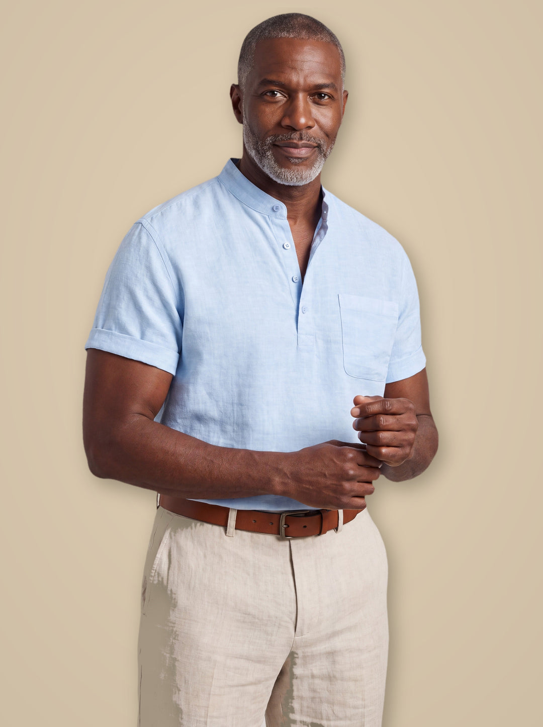Sterling linen shirt in Light Blue, worn by a model on a warm taupe studio background - Gentlemens Manor