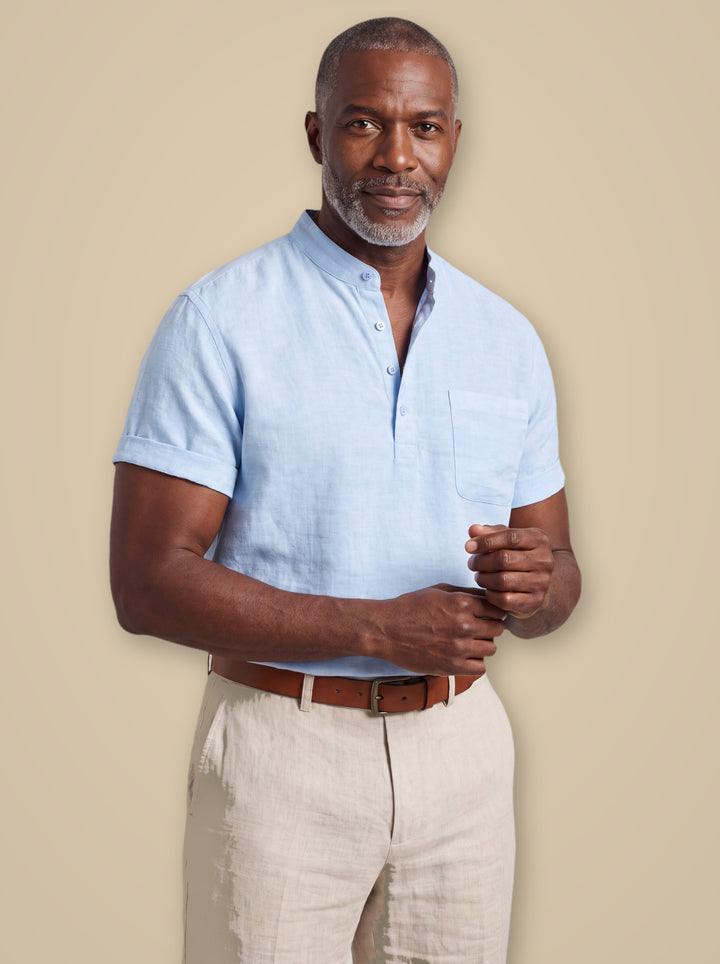 Sterling linen shirt in Light Blue, worn by a model on a warm taupe studio background - Gentlemens Manor