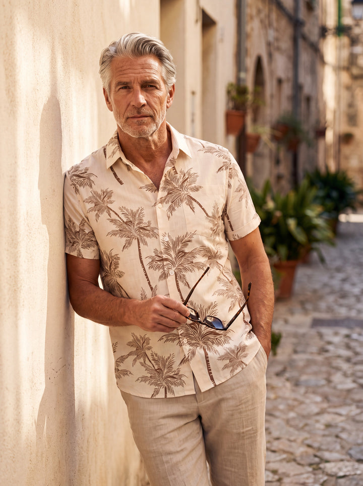 Sterling Men short sleeve shirt in Sand, worn by a model on a Mediterranean terrace - Gentlemens Manor lifestyle