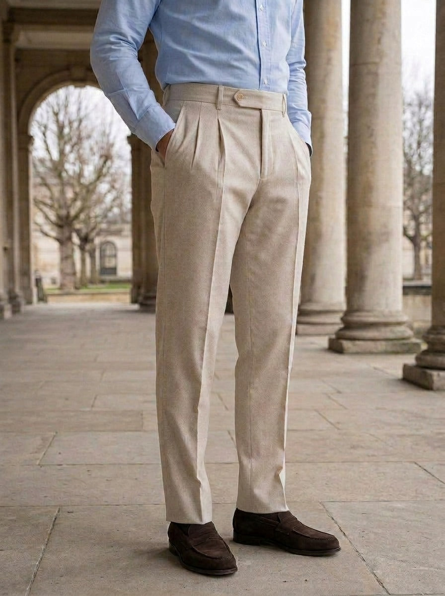 Talcott pointed tab double pleated trousers in Beige, lifestyle in a stone colonnade, Gentlemens Manor