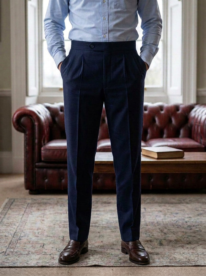 Talcott pointed tab double pleated trousers in Navy, lifestyle in a club reading room, Gentlemens Manor