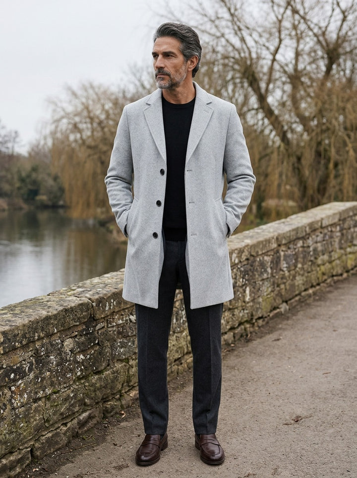 Thackeray overcoat in Light Grey, lifestyle on a stone footbridge, Gentlemens Manor