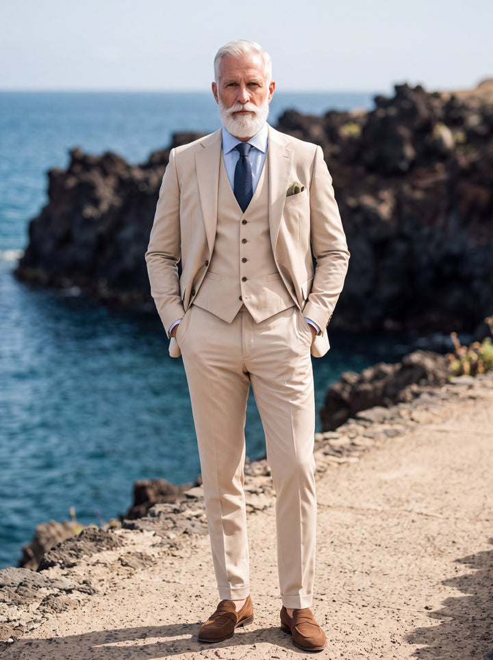 Thayer Men three-piece suit in beige, worn by a model in a Mediterranean setting - Gentlemens Manor lifestyle