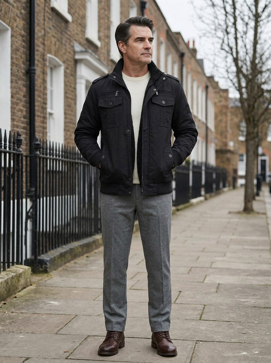 Tucker field jacket in Black, lifestyle on a street of brick row houses, Gentlemens Manor