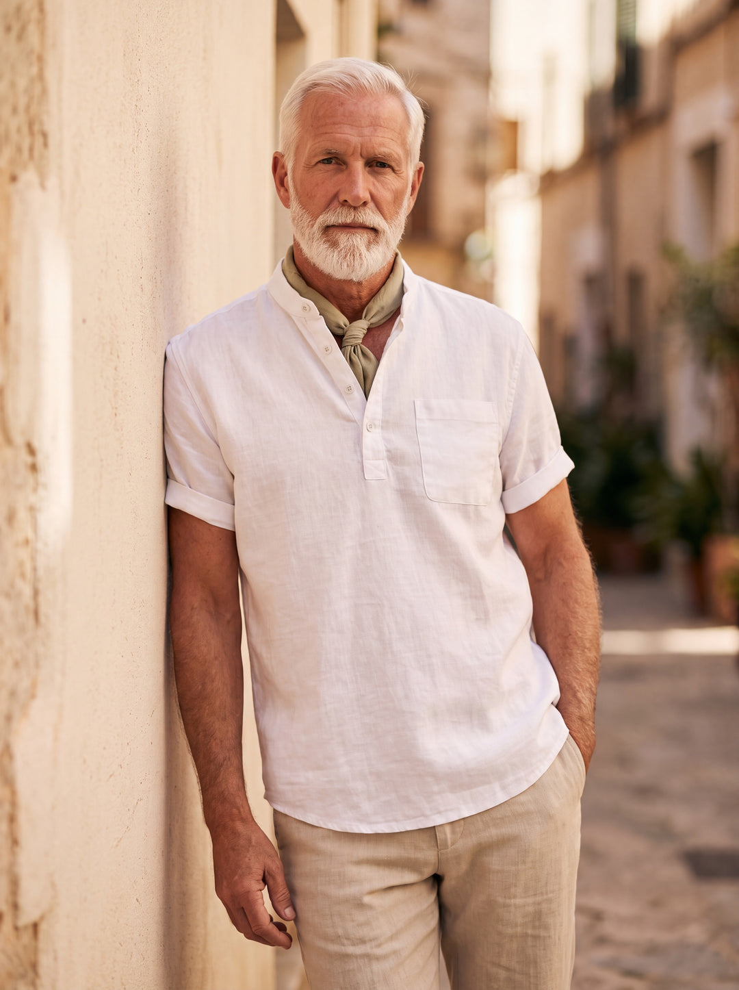Vincent Men linen shirt in white, worn by a model on a Mediterranean terrace - Gentlemens Manor lifestyle