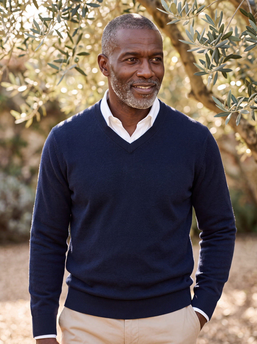 Wallace sweater in Navy, worn by a model in a Mediterranean setting - Gentlemens Manor lifestyle