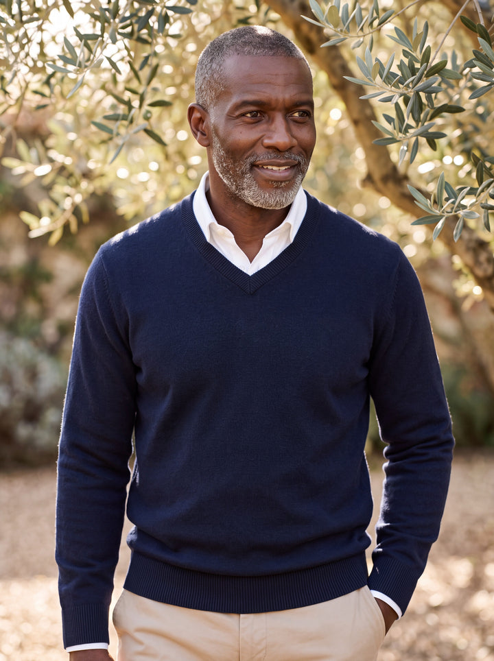 Wallace sweater in Navy, worn by a model in a Mediterranean setting - Gentlemens Manor lifestyle