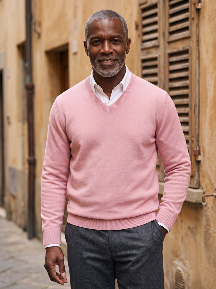 Wallace sweater in Pink, worn by a model in a Mediterranean setting - Gentlemens Manor lifestyle
