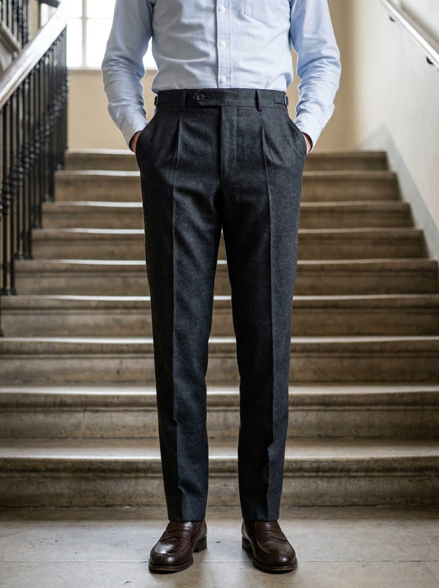 Warwick brushed pleated tapered trousers in Charcoal, lifestyle on a civic stone staircase, Gentlemens Manor