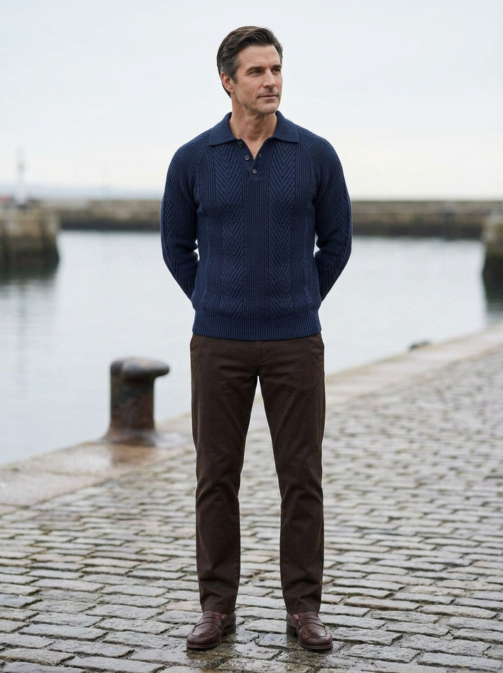 Wexford polo sweater in Navy, lifestyle on a stone harbor quay, Gentlemens Manor