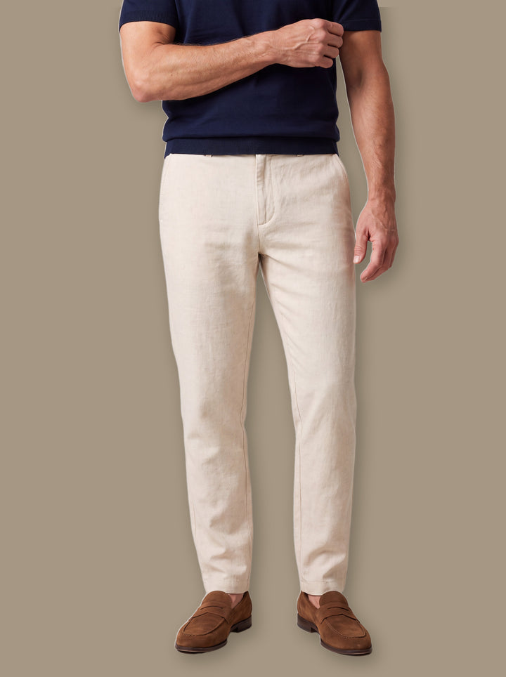 Whitfield trousers in Beige, worn by a model on a warm taupe studio background - Gentlemens Manor