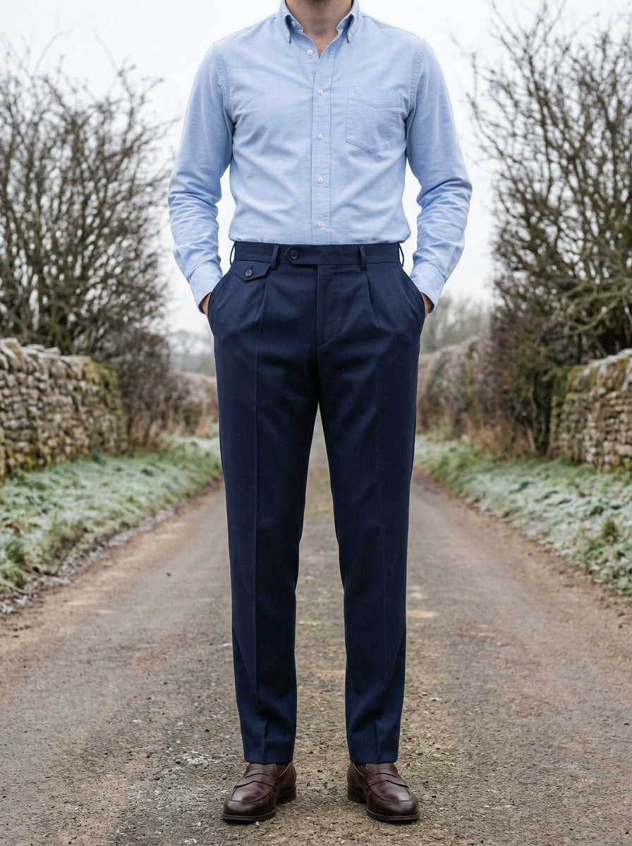 Wilfred button tab tapered trousers in Navy, lifestyle on a country lane, Gentlemens Manor
