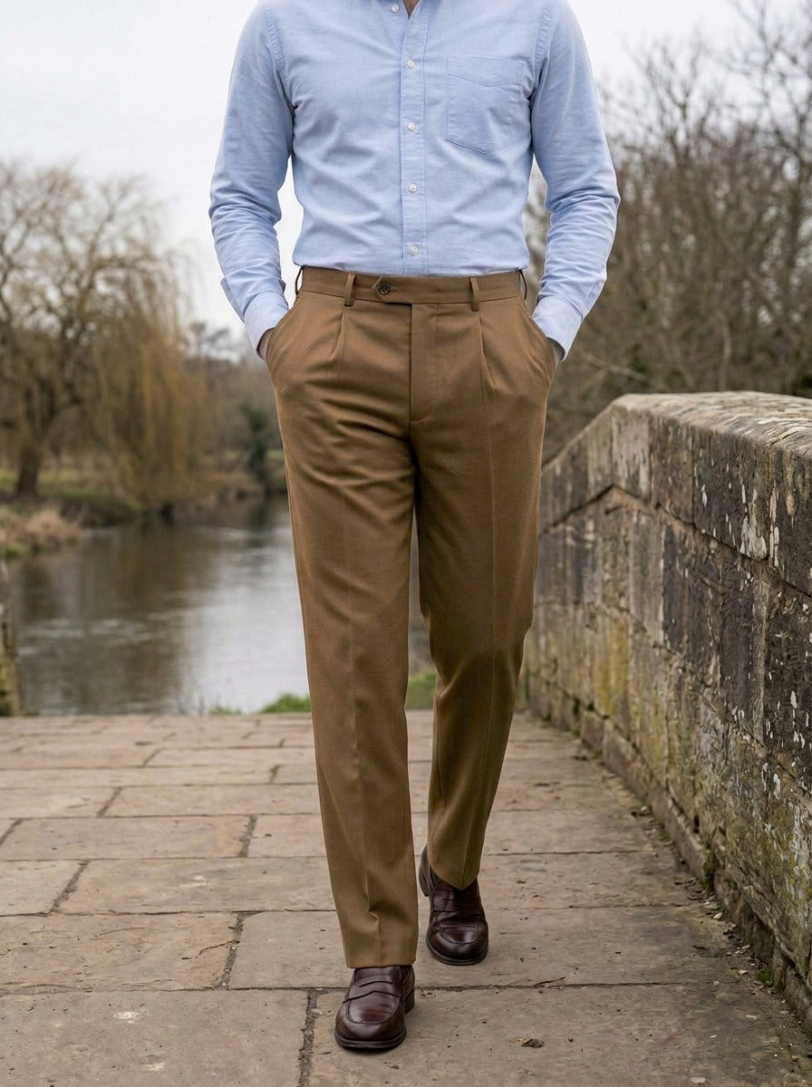 Wolcott pleated dress pants in Brown, lifestyle on a stone footbridge, Gentlemens Manor