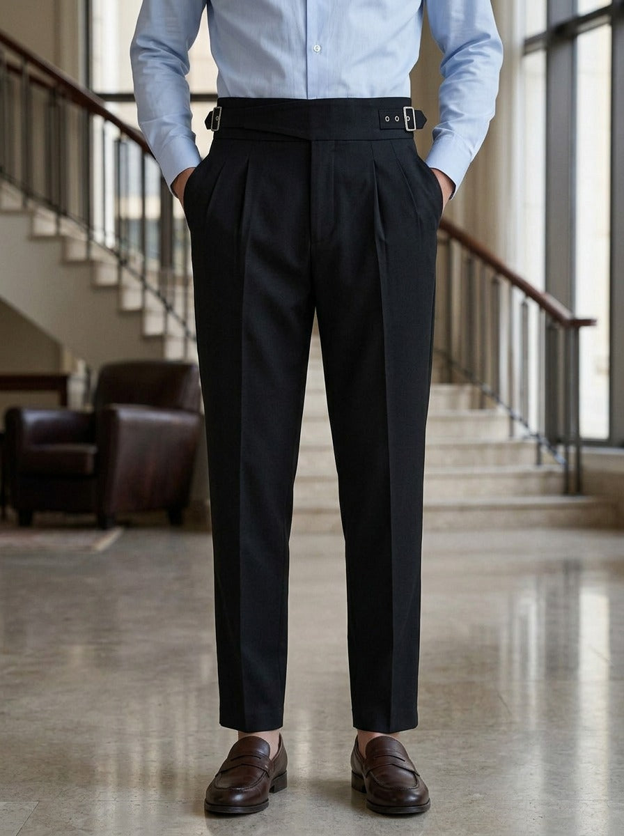 Wyatt crossover strap high waisted trousers in Black, lifestyle in a hotel lobby, Gentlemens Manor