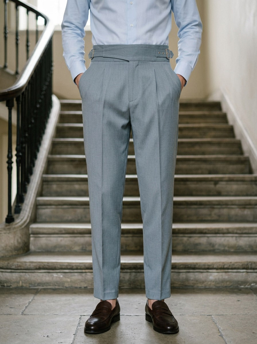 Wyatt crossover strap high waisted trousers in Grey, lifestyle on a civic stone staircase, Gentlemens Manor